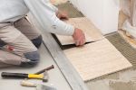 Man laying Tiles